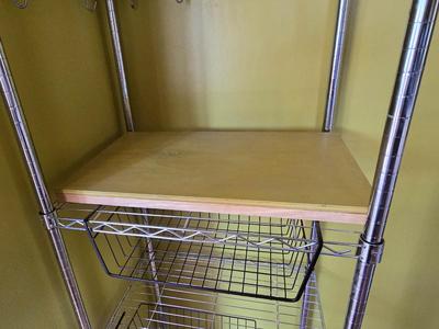 Stainless steel adjustable storage shelf with an assortment of hooks and clips - and some wood for shelves can honey do NSF Marked