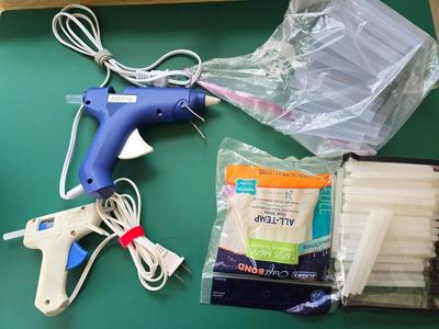 Two crafting glue guns and glue sticks to last a while