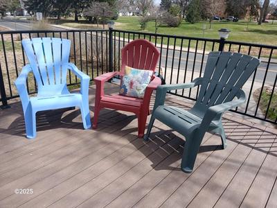 Three plastic Stackable Adirondack Chairs and a outdoor pillow - Keter chair
