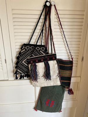 Assorted handwoven bags from various countries