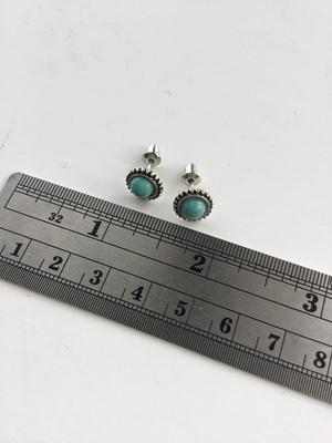 Unmarked light blue stud earrings