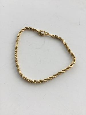 Gold tone unmarked twist look bracelet