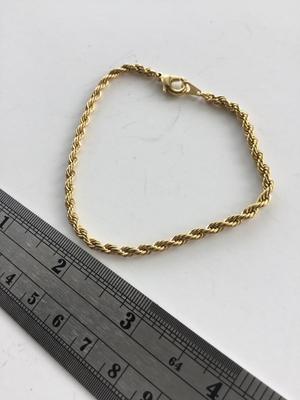 Gold tone unmarked twist look bracelet