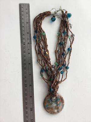 Beautiful multilayer statement necklace with matching earrings