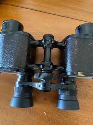 Transistor radios, camera lens, vintage binoculars