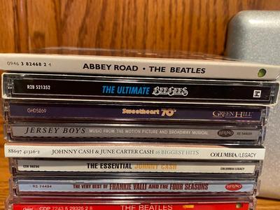MUSIC ON CD AND A TRAVEL CASE