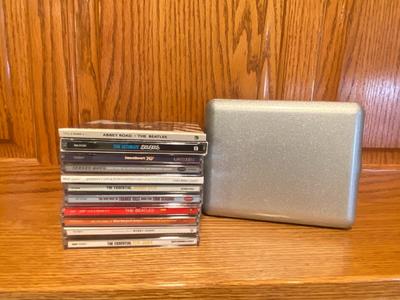MUSIC ON CD AND A TRAVEL CASE