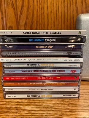 MUSIC ON CD AND A TRAVEL CASE
