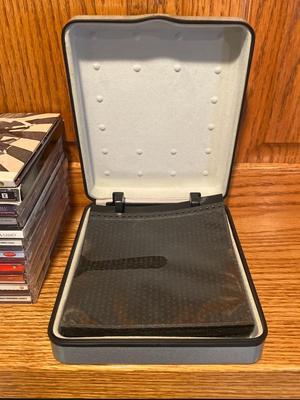 MUSIC ON CD AND A TRAVEL CASE