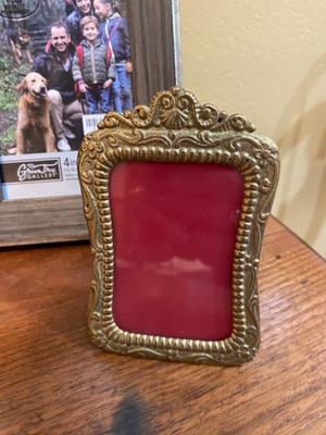 BOOKS, PICTURE FRAMES AND BRASS HOME DECOR
