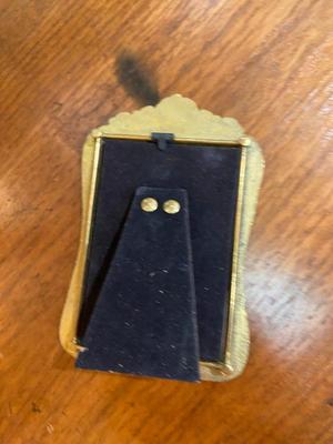 BOOKS, PICTURE FRAMES AND BRASS HOME DECOR