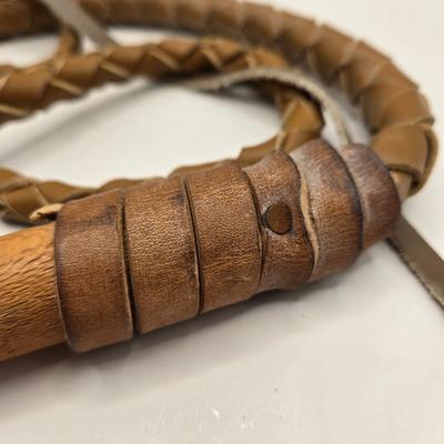 LOT 3: 18th, 19th Century Powder Horn , Brass Cobra Candle Holder, Polished Slab of Petrified Wood, and Vintage Leather Bull Whip