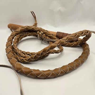 LOT 3: 18th, 19th Century Powder Horn , Brass Cobra Candle Holder, Polished Slab of Petrified Wood, and Vintage Leather Bull Whip