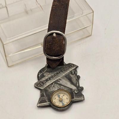LOT 21: 1927 N.Y. to Paris Compass with Leather Strap Commemorating Charles Lindbergh's Flight