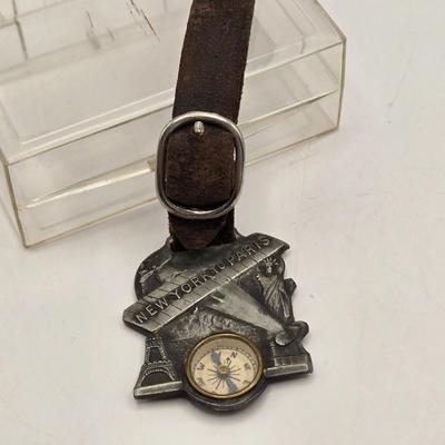 LOT 21: 1927 N.Y. to Paris Compass with Leather Strap Commemorating Charles Lindbergh's Flight