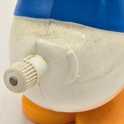 LOT 30: Poor Donald is Always Second Fiddle to Mickey: Vintage Donald Duck Squeak Toy, Kohner Donald Duck Push- Button Toy, Donald Duck...