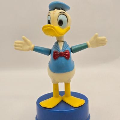 LOT 30: Poor Donald is Always Second Fiddle to Mickey: Vintage Donald Duck Squeak Toy, Kohner Donald Duck Push- Button Toy, Donald Duck...