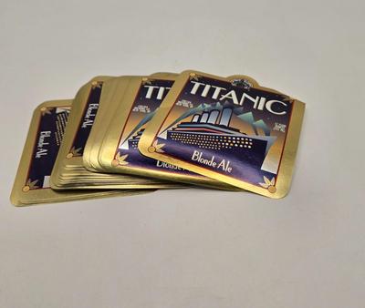 LOT 35: Italian Line, Cunard Queen Elizabeth and Queen Elizabeth II Menus, Deck Plan Maps, Passenger Lists, and Titanic Ale Labels