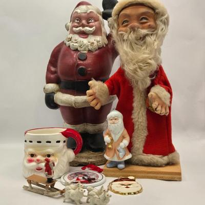 LOT 36: Vintage Cast Iron Santa Door Stop, Steiff Santa Hand Puppet, Putz Germany Santa Sleigh, Ceramic Santa & JC Penny Ornaments,...