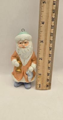 LOT 36: Vintage Cast Iron Santa Door Stop, Steiff Santa Hand Puppet, Putz Germany Santa Sleigh, Ceramic Santa & JC Penny Ornaments,...