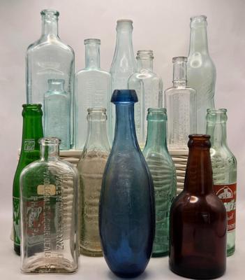LOT 161: Multiple Vintage/Antique Glass Bottles Including Blue Tenpin Soda, Hires Root Beer, Flavoring Extracts, and More