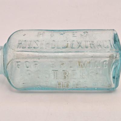 LOT 161: Multiple Vintage/Antique Glass Bottles Including Blue Tenpin Soda, Hires Root Beer, Flavoring Extracts, and More