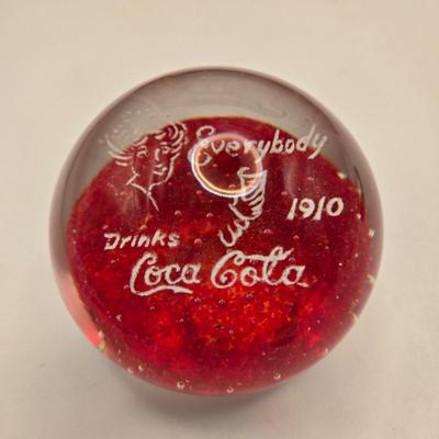 LOT 164: Have a Coke and a Smile: Multiple Vintage Coca-Cola Collectors Items Including Bottles, Glass Paperweight, Metal tray, and Much...