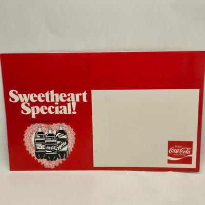 LOT 164: Have a Coke and a Smile: Multiple Vintage Coca-Cola Collectors Items Including Bottles, Glass Paperweight, Metal tray, and Much...