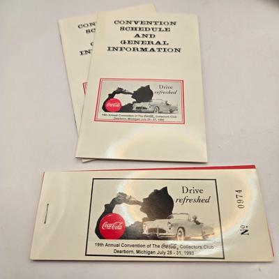 LOT 164: Have a Coke and a Smile: Multiple Vintage Coca-Cola Collectors Items Including Bottles, Glass Paperweight, Metal tray, and Much...