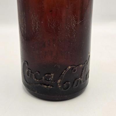 LOT 164: Have a Coke and a Smile: Multiple Vintage Coca-Cola Collectors Items Including Bottles, Glass Paperweight, Metal tray, and Much...