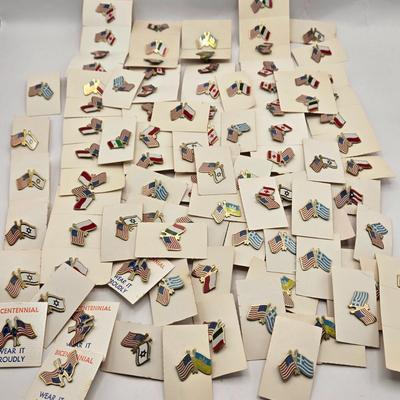 LOT 176: Numerous Vintage Friendship Flag Lapel Pins
