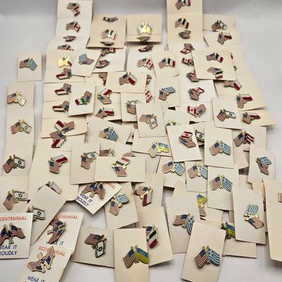 LOT 176: Numerous Vintage Friendship Flag Lapel Pins