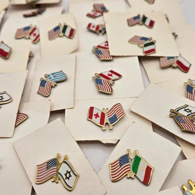 LOT 176: Numerous Vintage Friendship Flag Lapel Pins