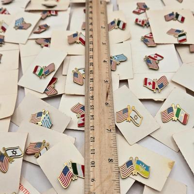 LOT 176: Numerous Vintage Friendship Flag Lapel Pins
