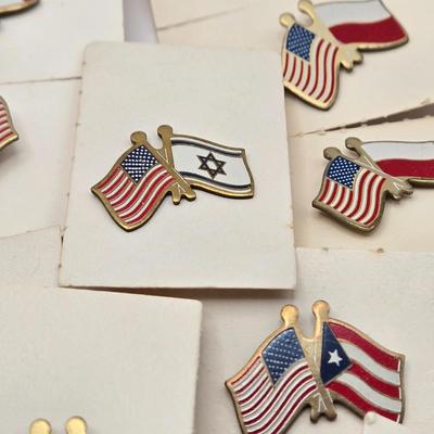 LOT 176: Numerous Vintage Friendship Flag Lapel Pins