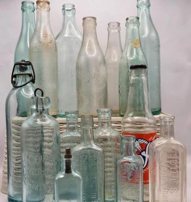 LOT 183: Multiple Vintage Glass Bottles Including Whistle, Scott's Emulsion, Hires, Big Frosty, and Many More