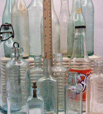 LOT 183: Multiple Vintage Glass Bottles Including Whistle, Scott's Emulsion, Hires, Big Frosty, and Many More