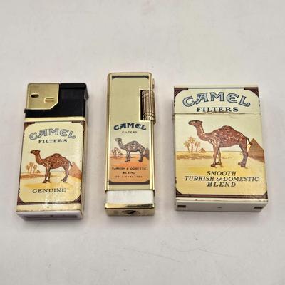 LOT 193: Vintage Cigarette Advertisements, Lucky Strike Bridge , Camel Brand Lighters, and More