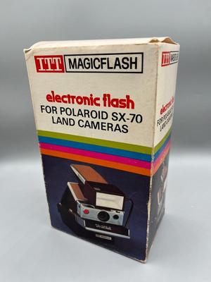 LOT 223: Vintage SX-70 Polaroid Land Camera, Flash and Film