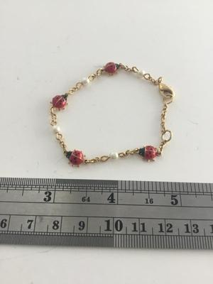 Gold tone lady bug fashion bracelet