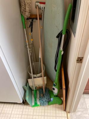 Vintage dust, pans, mops, ironing board, and mop