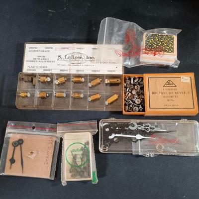 LOT 415: Large Collection of Clock Parts - Weights, Springs, Pendulums, Hands & More