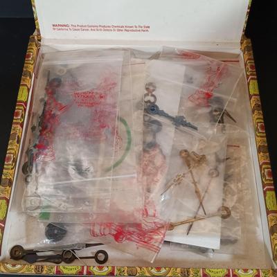 LOT 415: Large Collection of Clock Parts - Weights, Springs, Pendulums, Hands & More