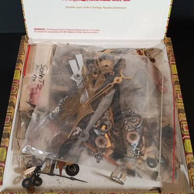 LOT 415: Large Collection of Clock Parts - Weights, Springs, Pendulums, Hands & More