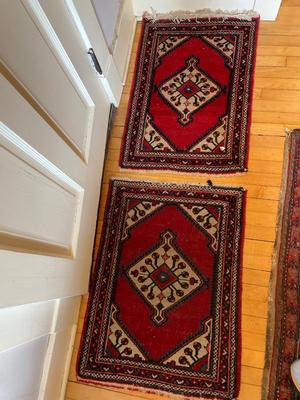 Two small hand-woven area rugs