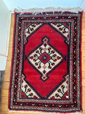 Two small hand-woven area rugs