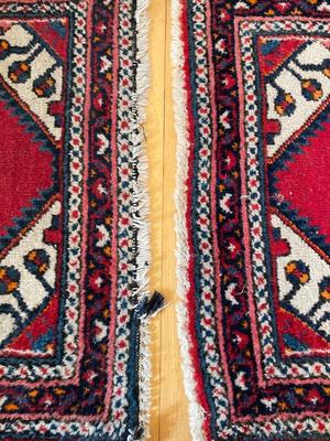 Two small hand-woven area rugs