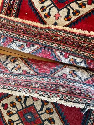 Two small hand-woven area rugs