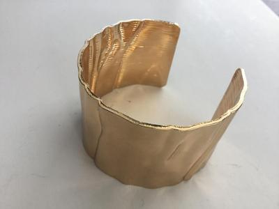 Gold tone cuff bracelet