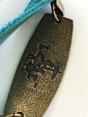 LE marked snap on leather type sister bracelet
